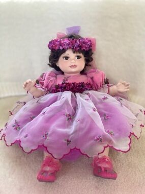 Marie Osmond porcelain doll with pink dress